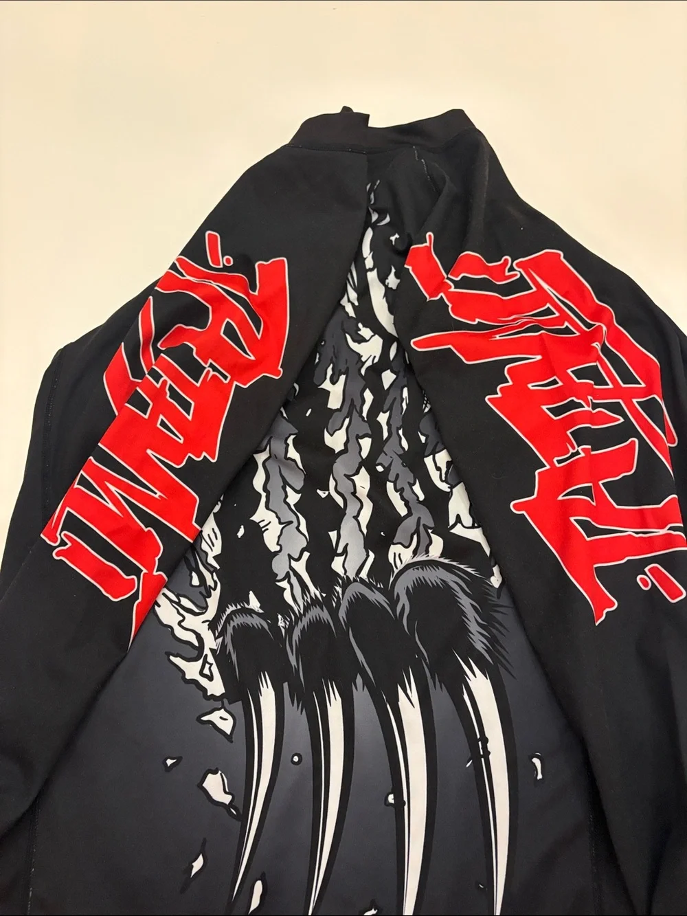 Tatami Fightware x Meerkatsu Original artwork black rash guard w/ animal graphic
